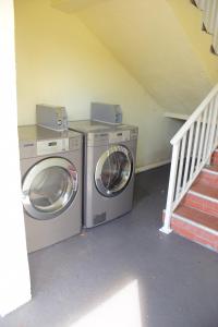 a washer and dryer in a room with a staircase at Flamingo Motel in Okeechobee