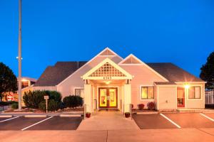 a white house with a driveway in front of it at Residence Inn Denver Tech Center in Greenwood Village