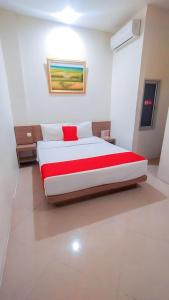 Postel nebo postele na pokoji v ubytování Hotel Domino