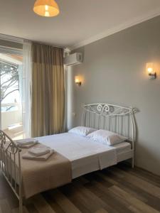 Postel nebo postele na pokoji v ubytování Argo Hotel