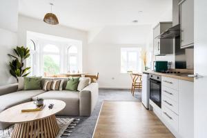 a living room with a couch and a table at Newport Ship's Nook: Cozy Hideaway in Newport