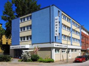 a blue building with a sign on the side of it at Elbbrücken Hotel in Hamburg