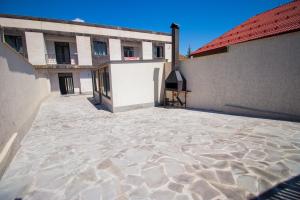 an empty courtyard of a building with a building at Happy home in Tsaghkadzor