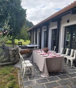 a table and chairs sitting on a patio at Casa da Queira in Ares