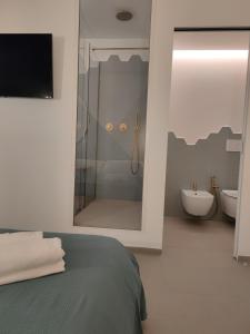 Postel nebo postele na pokoji v ubytování Sfumature D'aMare