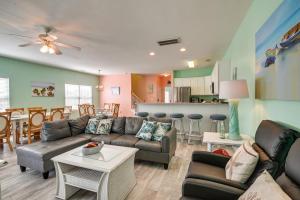 a living room with a couch and a table at Surfside Beach House with Pool, Walk to Beach and Pier in Myrtle Beach