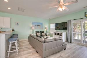 a living room with a couch and a table at Surfside Beach House with Pool, Walk to Beach and Pier in Myrtle Beach