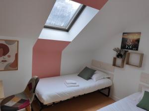 Postel nebo postele na pokoji v ubytování Hotel Au Val Doré
