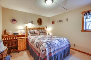 a bedroom with a bed and a dresser and a window at The Apartment Retreat Near Mount Rushmore in Hermosa