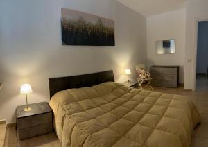 Postel nebo postele na pokoji v ubytování Casa vacanze Giuliani via Rasiglia