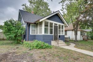 a blue and white house with a yard at Charming and Updated Home in Howe Neighborhood! in Minneapolis