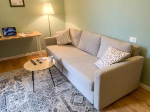 a living room with a couch and a table at Casa in Centro. Nel cuore della città. in Chieti