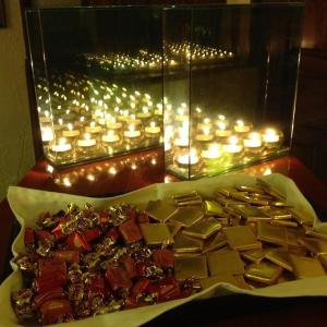 a plate of food with candles and liturgical at Fanaras Hotel in Kalavrita