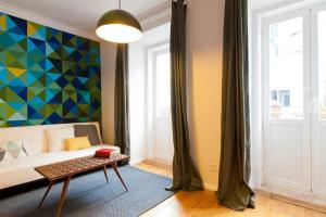 En eller flere senge i et værelse på Lisbon Sant'Anna Apartments