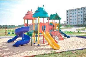 a playground with a slide in a park at Vipingo Palm - 3BDR Apartment in Vipingo