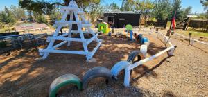 a park with a playground with a play structure at Ecobosque y cabañas in Paredones