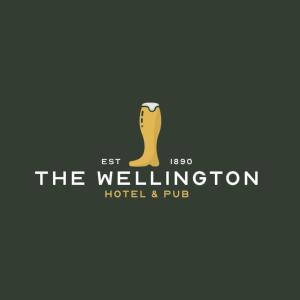 a logo for the wellington hotel and pub at The Wellington Hotel Birmingham - Breakfast Included City Centre Near O2 Academy in Birmingham