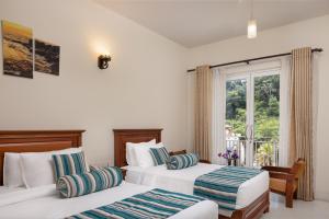 Letto o letti in una camera di Hotel Cassendra