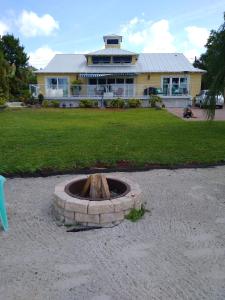 a fire pit in front of a house at Million Dollar Lake View in Orlando