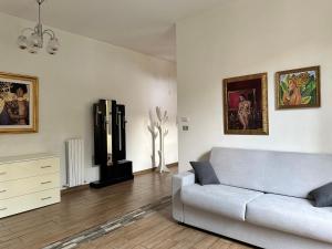 a living room with a couch and a dresser at COSENZA Savoia 16 in Cosenza