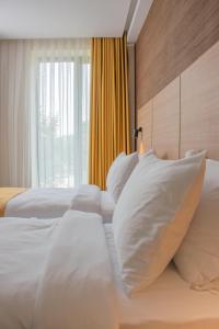 Postel nebo postele na pokoji v ubytování Hotel Osetia Garden