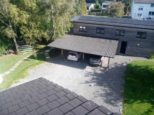 an aerial view of a garage with a car parked in it at L'écurie gîte chambre in Spa