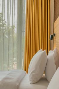 Postel nebo postele na pokoji v ubytování Hotel Osetia Garden