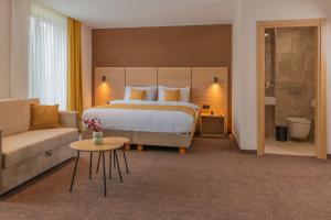 Postel nebo postele na pokoji v ubytování Hotel Osetia Garden
