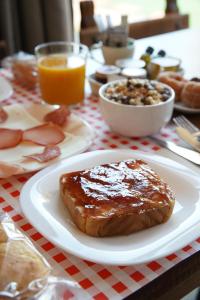 a table with a plate of food on a table at HOTEL POSADA LaS RETAJAS in Medinaceli