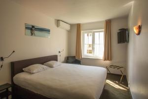 Voodi või voodid majutusasutuse St-Janshof Hotel toas