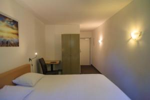 Voodi või voodid majutusasutuse St-Janshof Hotel toas