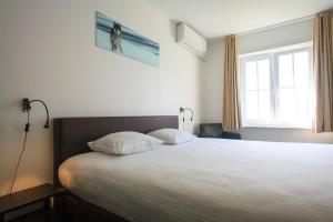 Voodi või voodid majutusasutuse St-Janshof Hotel toas