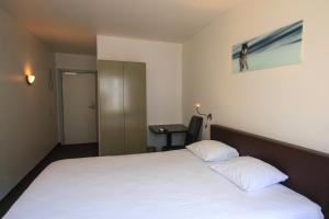 Voodi või voodid majutusasutuse St-Janshof Hotel toas