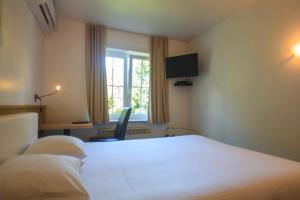 Voodi või voodid majutusasutuse St-Janshof Hotel toas