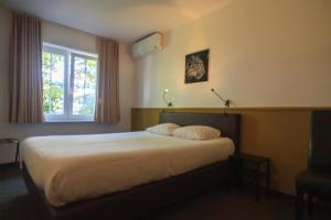 Voodi või voodid majutusasutuse St-Janshof Hotel toas