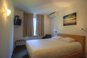Voodi või voodid majutusasutuse St-Janshof Hotel toas