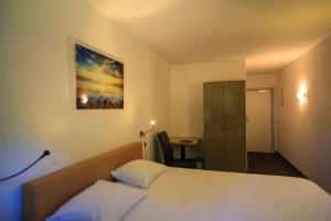 Voodi või voodid majutusasutuse St-Janshof Hotel toas