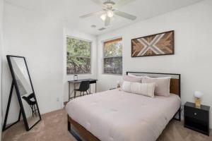 a bedroom with a bed and a desk in it at West Sedona Retreat in Sedona