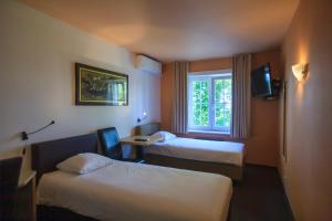 Voodi või voodid majutusasutuse St-Janshof Hotel toas