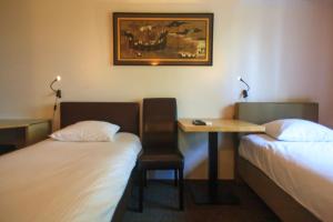 Voodi või voodid majutusasutuse St-Janshof Hotel toas
