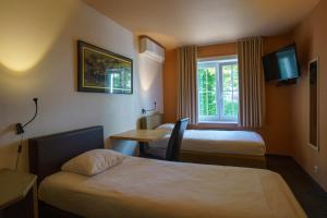 Voodi või voodid majutusasutuse St-Janshof Hotel toas