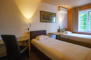 Voodi või voodid majutusasutuse St-Janshof Hotel toas
