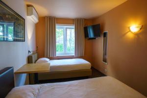 Voodi või voodid majutusasutuse St-Janshof Hotel toas