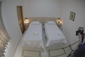 מיטה או מיטות בחדר ב-Hotel San Gennaro