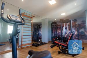 a room with a gym with a treadmill at Studio a 150m da praia de Piatã in Salvador