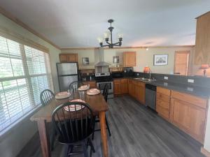 a large kitchen with a table and chairs in it at Stagecoach Inn Woodville in Woodville