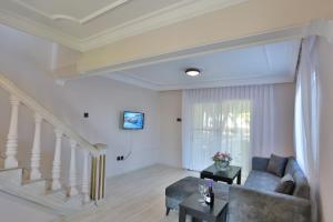 a living room with a couch and a staircase at House w Pool Balcony 5 min to Beach in Kyrenia in Kyrenia