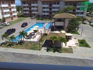 Θέα της πισίνας από το Guarajuba - apartamento 2 quartos com suíte e piscina raia olímpica ή από εκεί κοντά