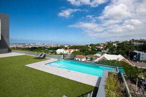 a swimming pool on the roof of a house at Stunning 902 Florida Road in Durban