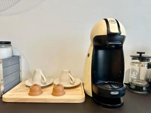 a coffee maker sitting on top of a counter at Elegant apartment with Sauna in the center in Rovaniemi